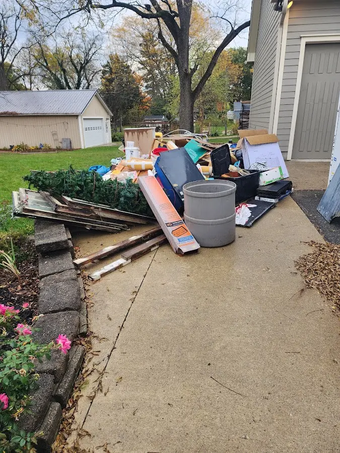 Dumpster being loaded with debris for Residential Dumpster Rental in Sandersville